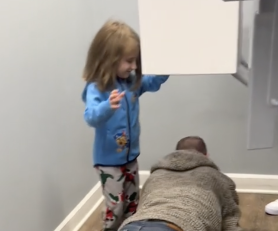 girl stands on orthodontist's back